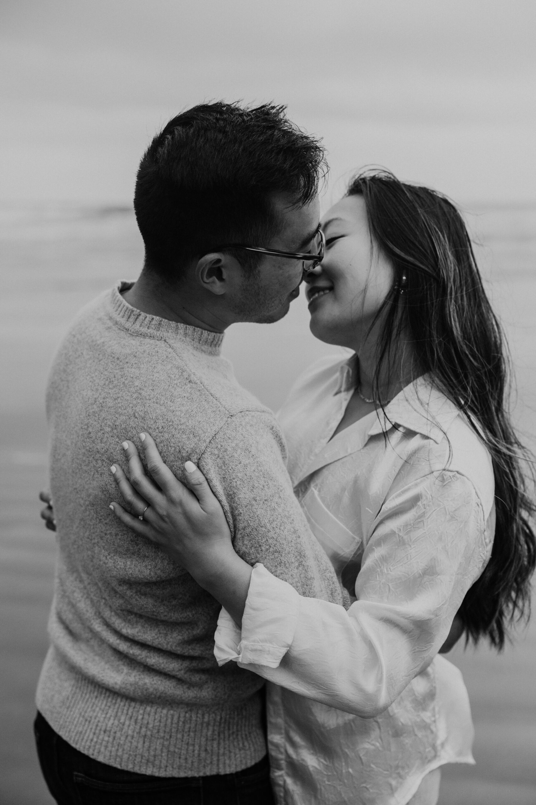 Couple facing each other and smiling while hugging